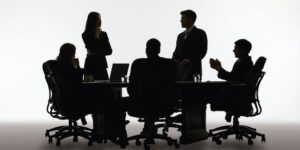 a group of people at a meeting table having a discussion