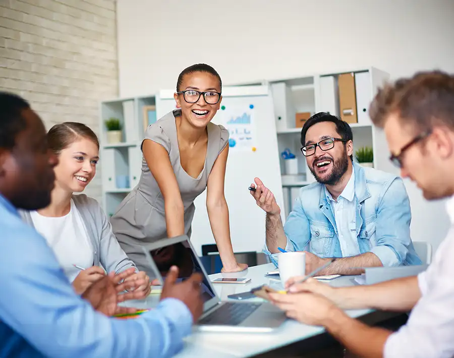Happy employees working together in a meeting