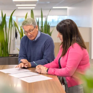 Walsh employees discussing insurance solutions for a client