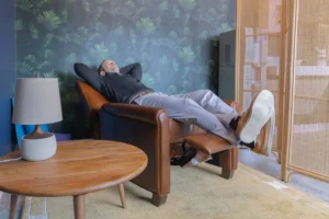 Picture of an employee relaxing in the "Zen Room" at the Walsh Buffalo office